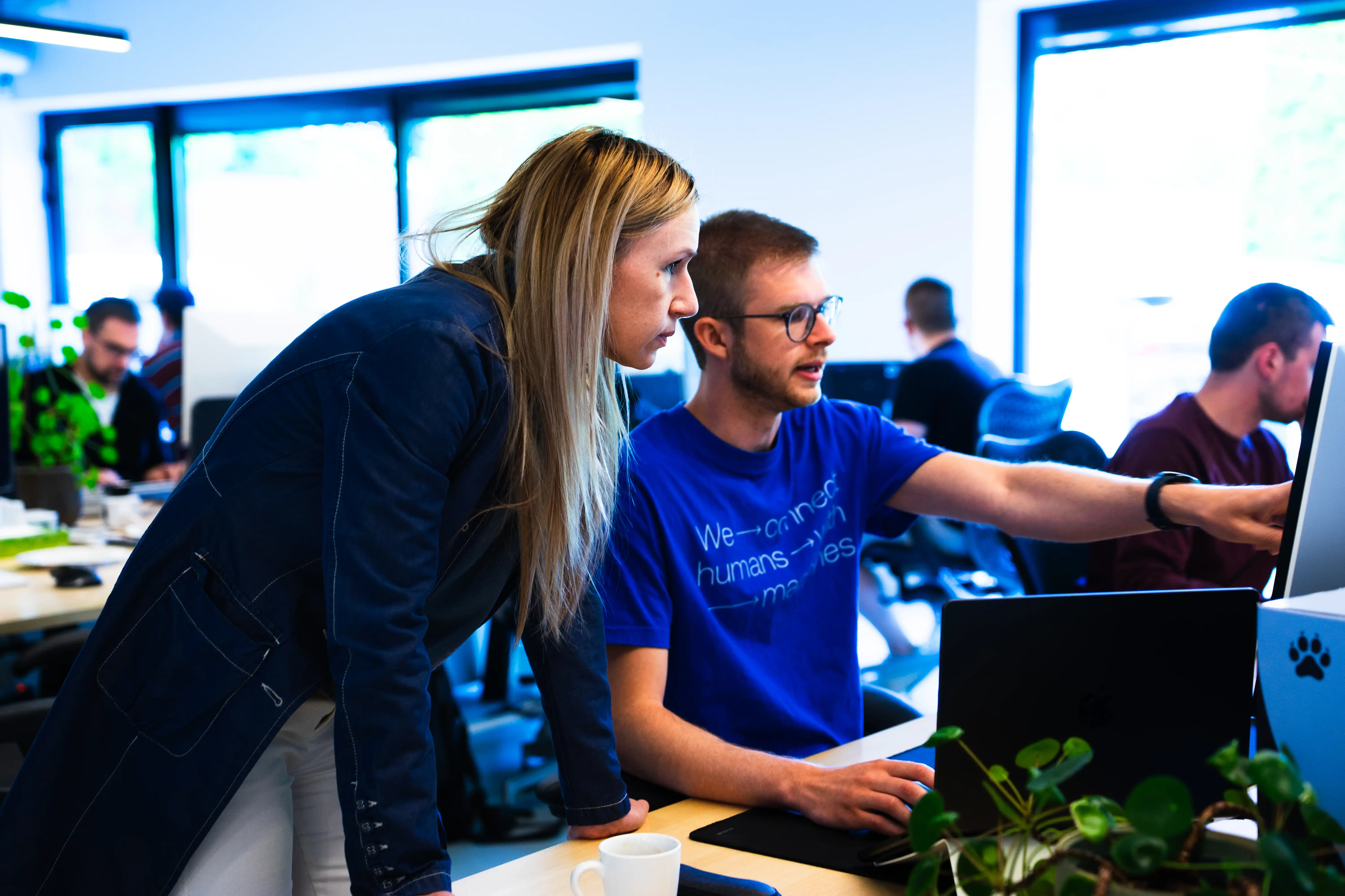 Two Aaltra colleagues going through a product together on screen